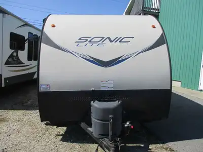 A lightweight family trailer with a front fold down dinette / Murphy bed , two rear bunks and side b...