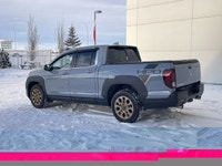 Our 2023 Honda Ridgeline Touring in Sonic Grey with the Honda Performance Development Package is in... (image 5)