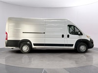 Meet the 2025 Ram ProMaster Cargo Van Tradesman 3500 High Roof Ext 159 WB w/Pass Seat, dressed in a... (image 5)