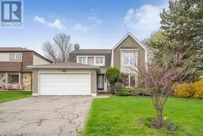 Rarely offered 4-bedroom, Updated, detached home on a premium pie-shaped corner lot with an 81 ft wi...