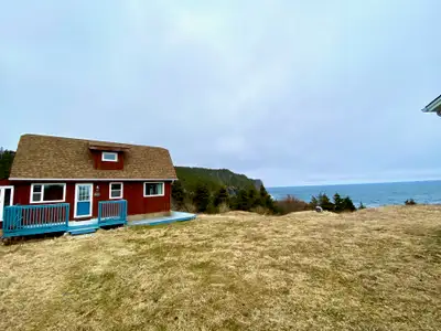 15 Hickey's Lane is a fully furnished, two bedroom, cedar home situated on the most amazing lot, wit...
