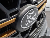 Introducing the 2026 Ford F-150 Tremor, dressed in a stunning white exterior and equipped with a rob... (image 9)