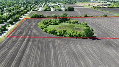 P05//Portage La Prairie/Uncover a rare, high-yield investment with this expansive 7-acre parcel (one...