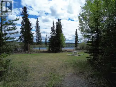 Set on 1.26 acres with approximately 315 feet of pristine waterfront, this exceptional property offe...