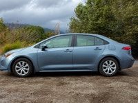 The 2020 Toyota Corolla LE, with its stunning blue exterior and efficient front-wheel drive, offers... (image 4)