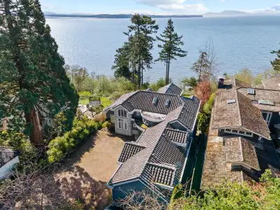 Gated waterfront estate with spectacular ocean views, set on an expansive 22,651 sqft lot. This eleg...