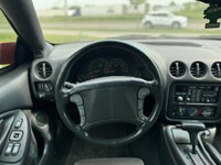 La Pontiac Firebird Trans Am 1994 est lun des modèles les plus emblématiques de lère des voitures sp... (image 7)
