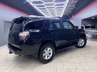 Experience the rugged elegance of the 2016 Toyota 4Runner SR5, presented in a commanding Black finis... (image 3)