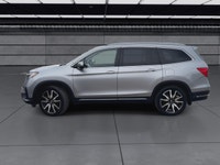The 2021 Honda Pilot Touring 8-Passenger AWD in Silver is an exceptional choice for those seeking a... (image 4)