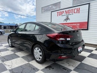 A practical compact sedan with efficient performance, modern convenience features, and a comfortable... (image 5)