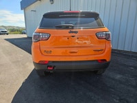 For a quick response please text 403-820-9940. AMVIC licensed business The 2026 Jeep Compass Trailha... (image 3)