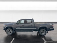 Experience proven reliability and rugged capability with the *2021 Toyota Tacoma*, featuring *143,96... (image 2)