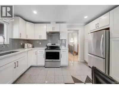 Incredible value in Marpole! New 3-storey home with 6 beds & 4 baths, including 2 mortgage-helper su...