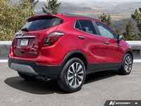 The 2020 Buick Encore Essence, dazzling in Winterberry Red Metallic with a sophisticated Ebony leath... (image 4)