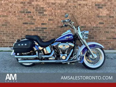 Beautiful Canadian two-tonne Softail Deluxe with a chrome front end, SE pipes, two-up seat, hard lea...
