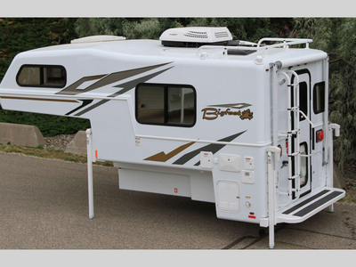 Bigfoot Industries 1500 Series truck camper C9.5 FS highlights: U-Shaped Dinette Overhead Cabinets S...