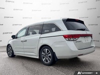 Simplify family journeys with the 2016 Honda Odyssey Touring. This white minivan, with 157,038 kilom... (image 3)