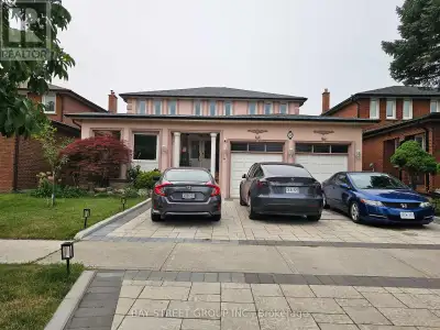 Bright and spacious furnished bedroom featuring large windows that provide abundant natural light. T...
