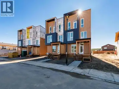 West Coast Modern meet Yukon Super Green! Welcome to 244 Witch Hazel, a townhome layout never seen b...