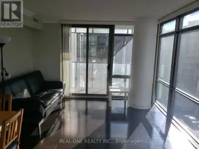 A bright and spacious corner unit with south west street view of bay street. Floor to ceiling curtai...