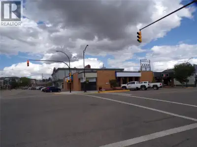 Across from Mile Zero Post at the center of Dawson Creek. Old BMO and current Red Tomato Pie buildin...