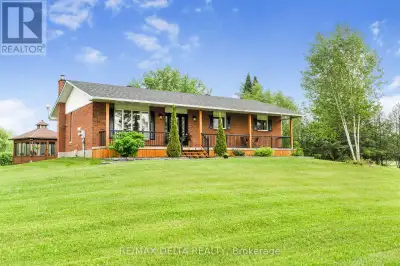 Your hobby farm awaits! This impeccable home with outbuildings, mature trees and eight acres is a ra...