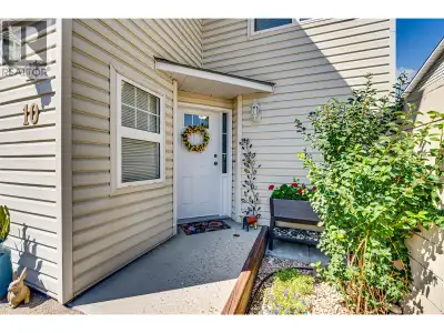 This sophisticated 3 bed/2 bath end unit townhome in a sought-after 55+ community presents an exquis...