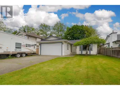 Westside Rancher on Quiet Cul-de-Sac Well-kept 3 bed, 2 bath rancher featuring hardwood floors, a ga...