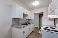 Amenities: Quiet Building • Heat & Water Included • Open Living Rooms Suite & Building: Spacious bac... (image 1)