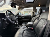 The 2023 Nissan Armada 4x4 Platinum in a striking black finish is a powerhouse SUV designed for both... (image 8)