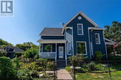 This beautiful Victorian-style century home brims with character and charm. Ideally situated close t...