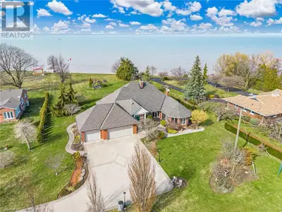 RARE OPPORTUNITY: LAKEFRONT LUXURY MEETS VINEYARD EXCELLENCE. Nestled along 120 feet of Lake Ontario...