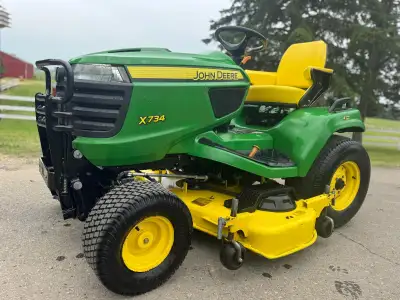 John Deere X734 2015 with attachments, View more