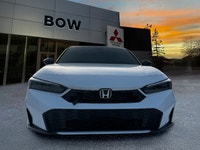 The 2025 Honda Civic Sedan Hybrid Sport in a stunning white finish combined with its FWD drivetrain... (image 1)