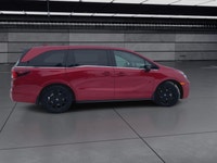 The 2025 Honda Odyssey Black Edition in a striking Red finish, equipped with a Front-Wheel Drive, of... (image 8)