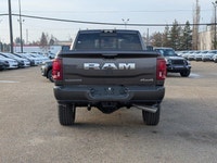 The 2026 Ram 3500 Laramie Crew Cab in Granite Crystal Metallic combines heavy-duty capability with p... (image 4)
