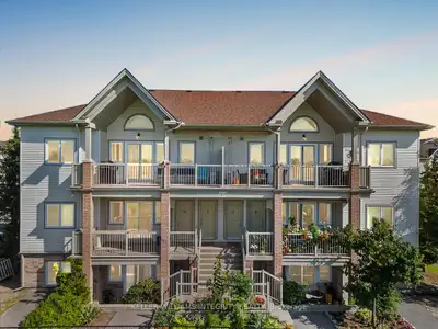 Welcome to this charming 2-bed, 1.5-bath ground-level stacked condo in Stittsville North! This well-...