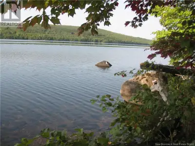 A RARE WATERFRONT OPPORTUNITY! Discover the perfect blend of nature and convenience with this stunni...