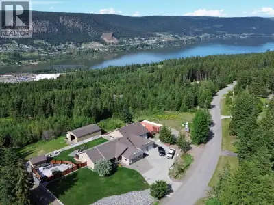 Stunning RANCHER home complete with DREAM SHOP, park-like acreage & unmatched panoramic views. Perch...