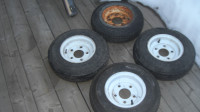 FOUR BRAND NEW 480 X 8 INCH TIRES ON 5 BOLT RIMS