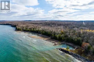 This unique offering of vacant land has approximately 700 feet of waterfront and 14 acres of land in...