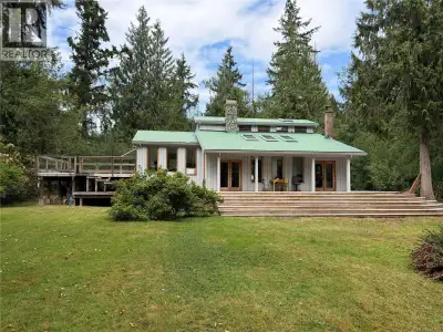 Located on 5 level acres in the highly desirable area of Qualicum Beach sits this custom-built 1991...