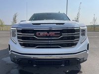 AMVIC Licensed Dealer The 2026 GMC Sierra 1500 SLT Crew Cab 4WD, finished in Summit White with a ref... (image 1)