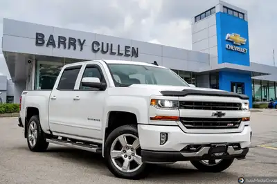 The 2018 Chevrolet Silverado 1500 LT in white offers the perfect balance of robust power and refined...