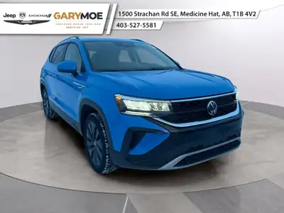 Experience the 2024 Volkswagen Taos Comfortline, a charming SUV in a striking Blue finish paired wit...