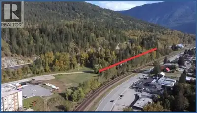 Exceptional * 19.037-acre development site in central Revelstoke with approx. 1,275 ft (388 m) of Hw...