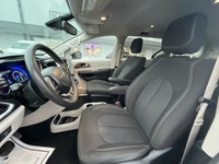 Experience the 2024 Chrysler Grand Caravan SXT in a pristine white finish, complete with efficient f... (image 3)