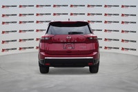 The 2025 Nissan Rogue Platinum, in striking Red, offers a sophisticated driving experience with only... (image 3)