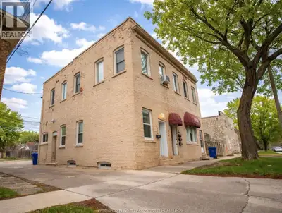 Charming upper unit featuring original hardwood floors, exposed brick, stunning modern fixtures and...