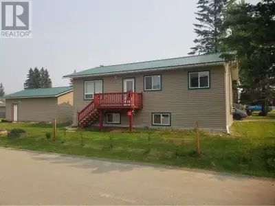 Flush with natural light, premium kitchen with granite center island and custom birch cabinetry make...
